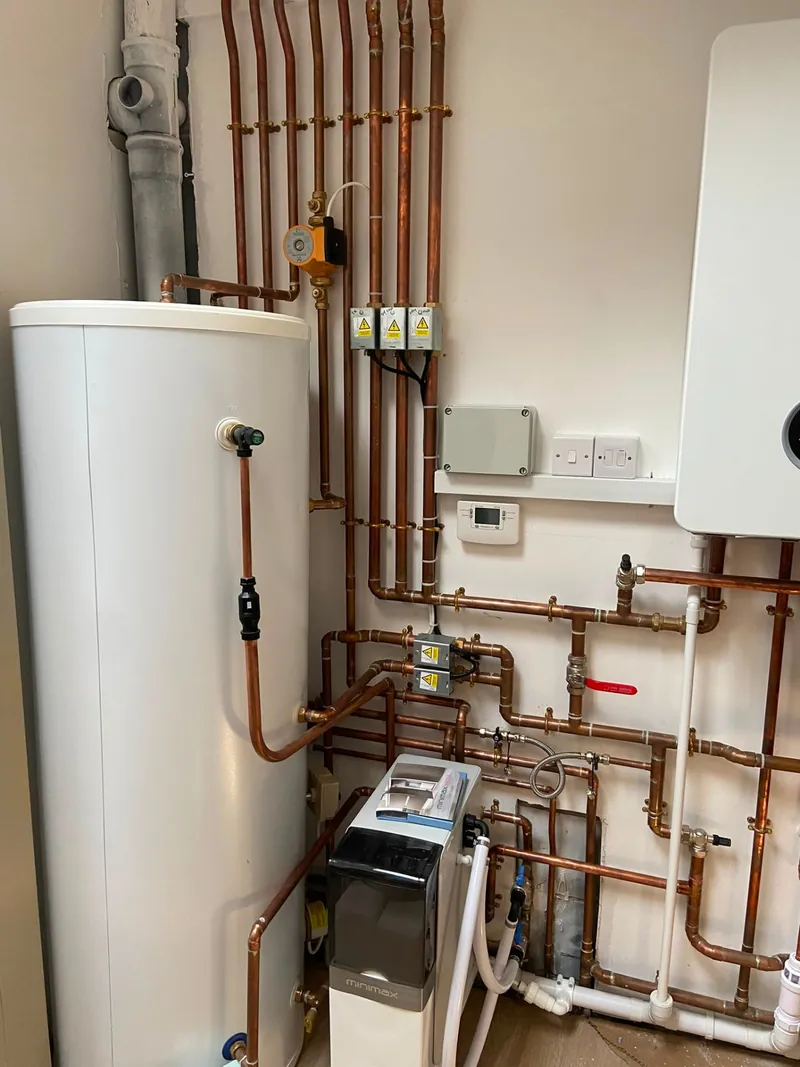 Unvented cylinder with water softener, zone valves and boiler pipework