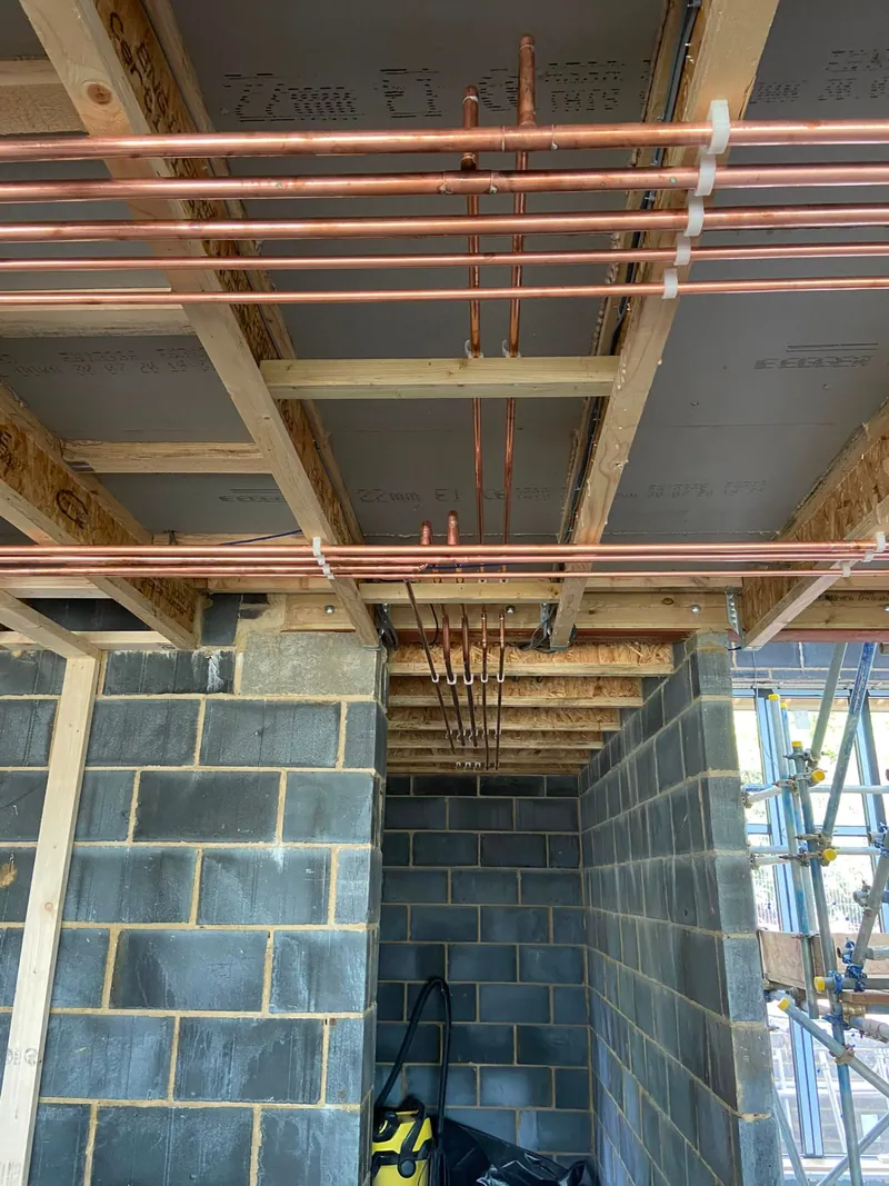 First-fix central heating pipework in a blockwork extension