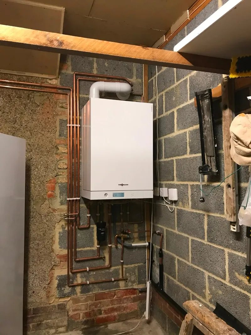 Viessmann boiler installation with system filter in a utility area