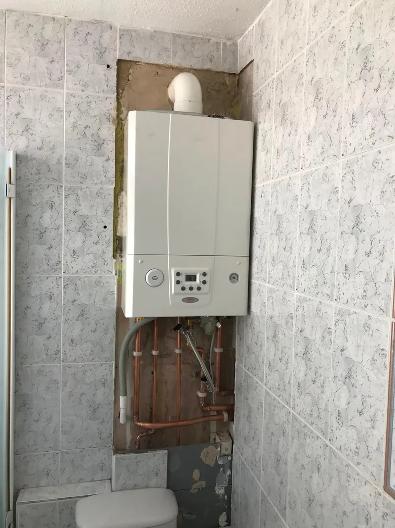 Alpha boiler installed in a tiled bathroom