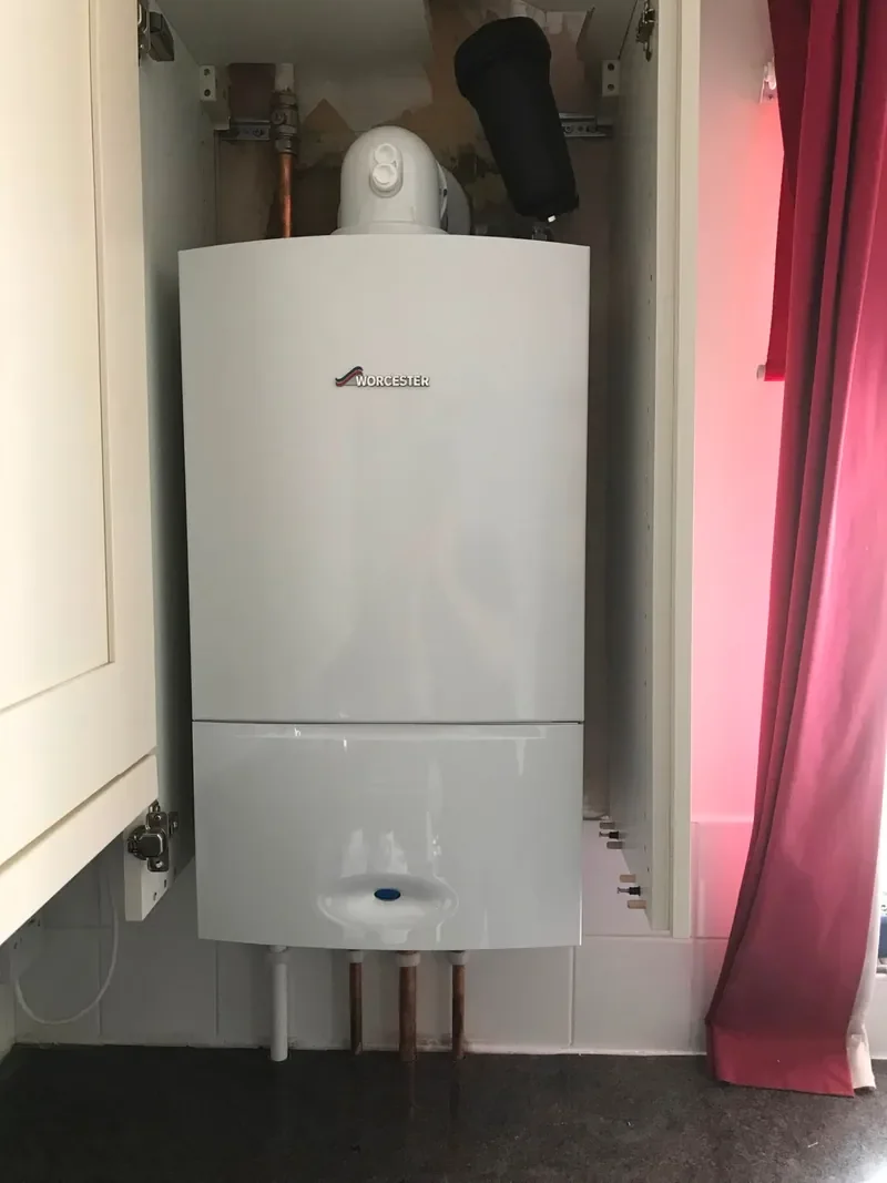 Worcester boiler installed in a kitchen wall cupboard