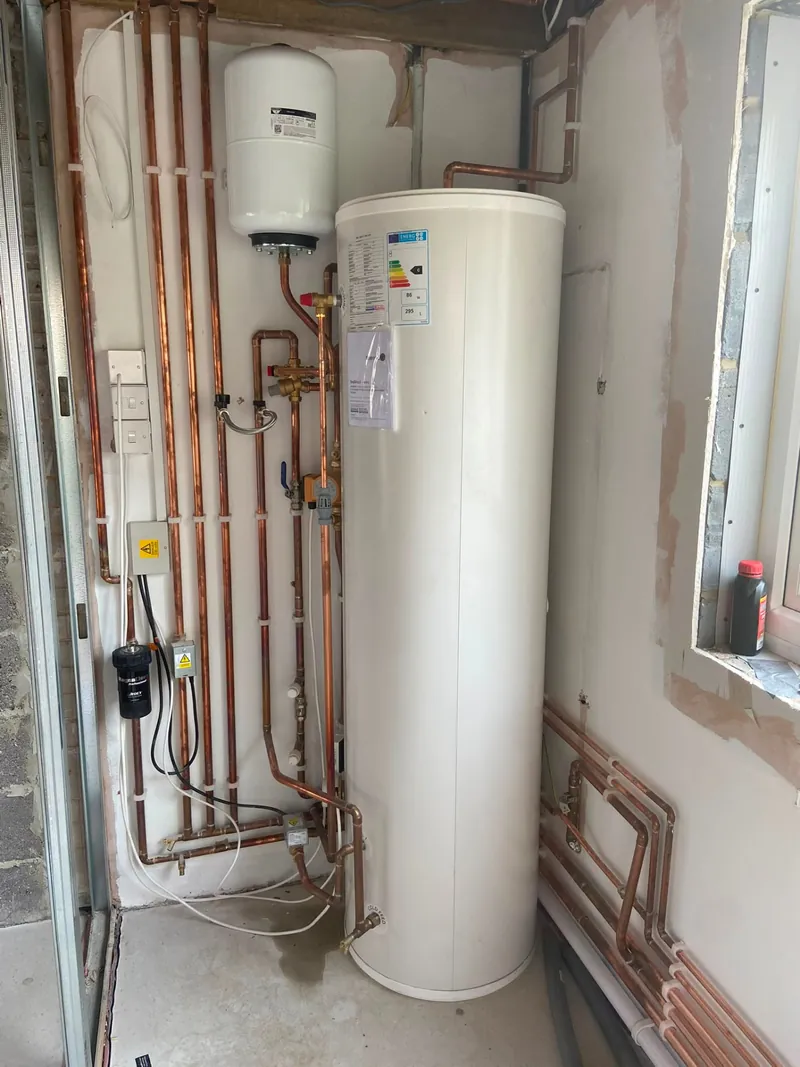 Unvented hot water cylinder installation with expansion vessel and copper pipework